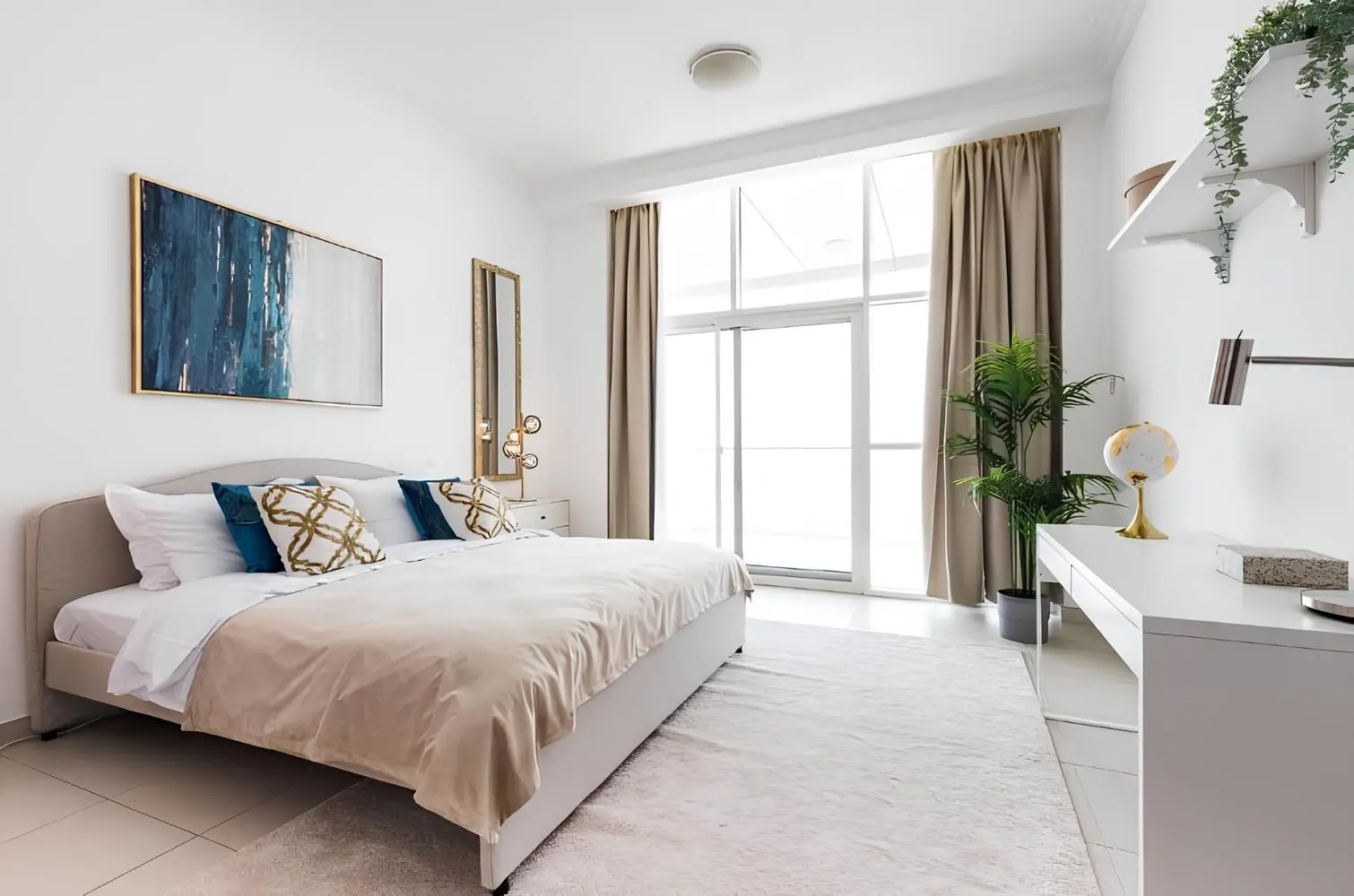 Bedroom with a large window shown in the AL MADAR INVESTMENT "Al Madar Scala Tower" catalogue, Dubai